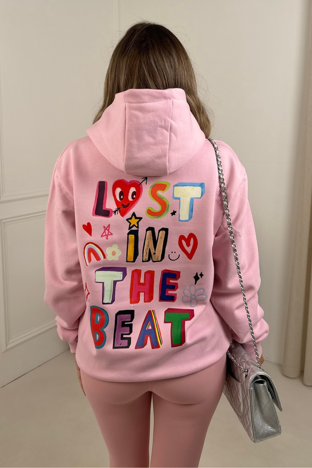 Lost in the beat pink printed premium hoodie